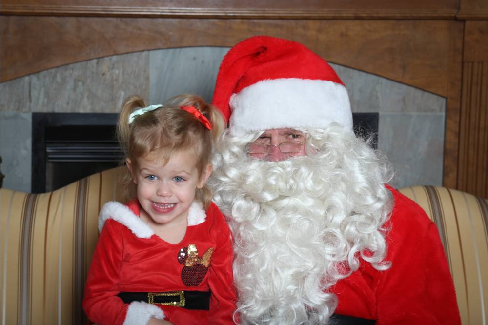 santa with young girl smiling